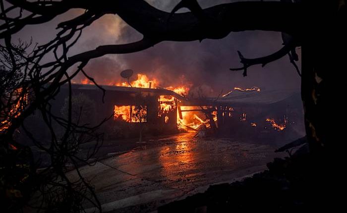 Wildfire burns through LA enclave known for its beaches and celebrity allure