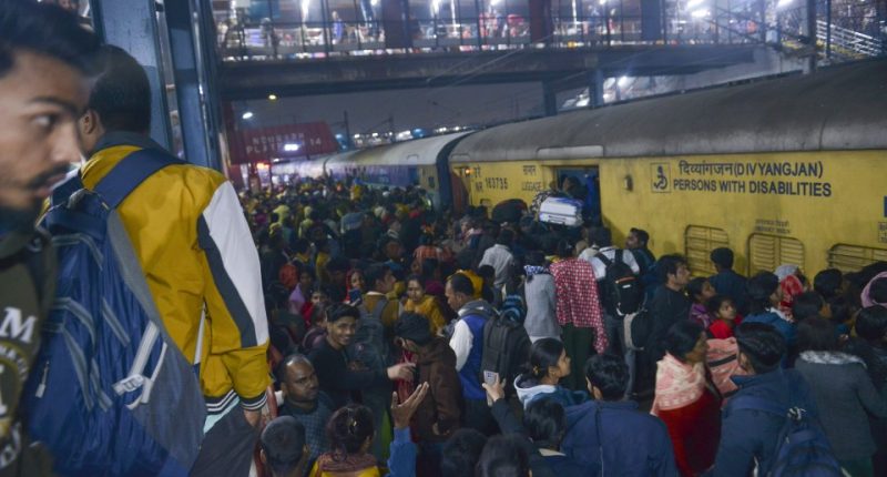 Crowded train platform in New Delhi, India.