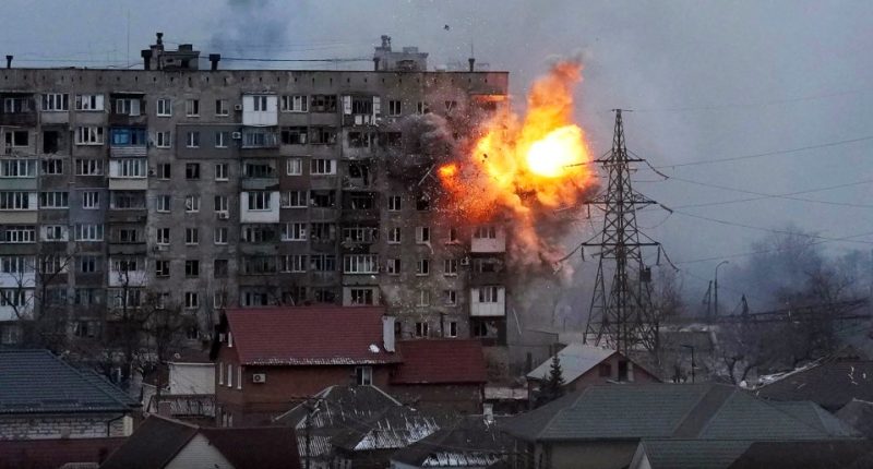 Explosion damaging an apartment building.