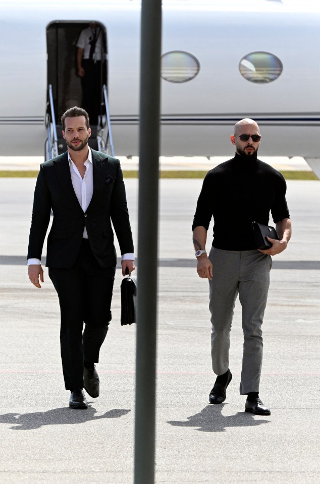 Andrew and Tristan Tate walking away from a private jet.