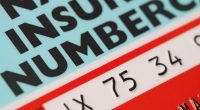 Close-up of a UK National Insurance number card.