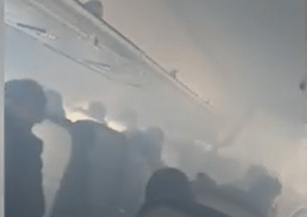 Smoke filling airplane cabin.