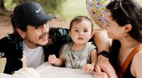 Family celebrating a baby's first birthday.