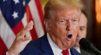 Donald Trump speaking at a press conference.