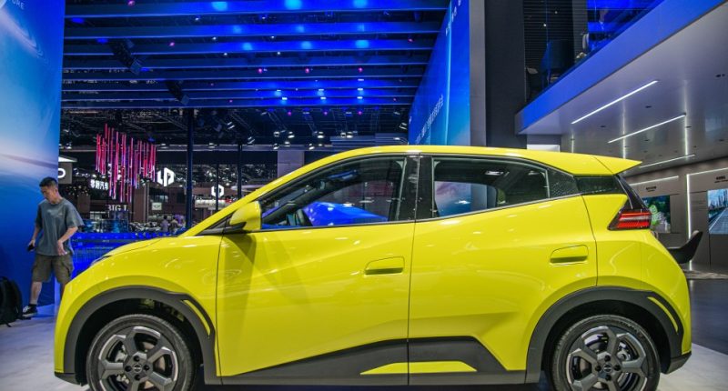 Yellow BYD Seagull electric car on display.