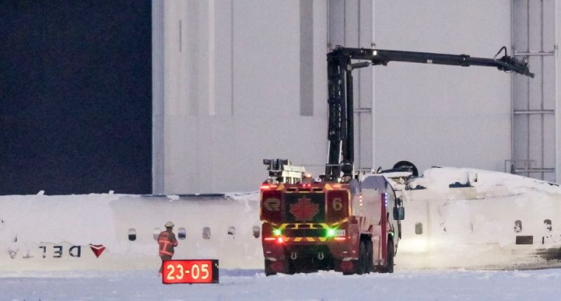 Emergency crews at the scene of a Delta Air Lines plane crash.