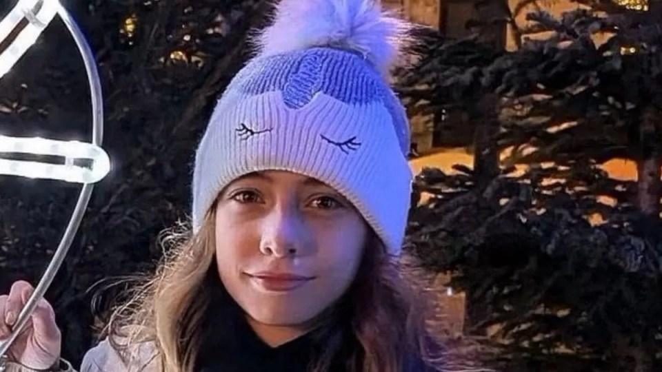 Photo of an 11-year-old girl wearing a unicorn hat.