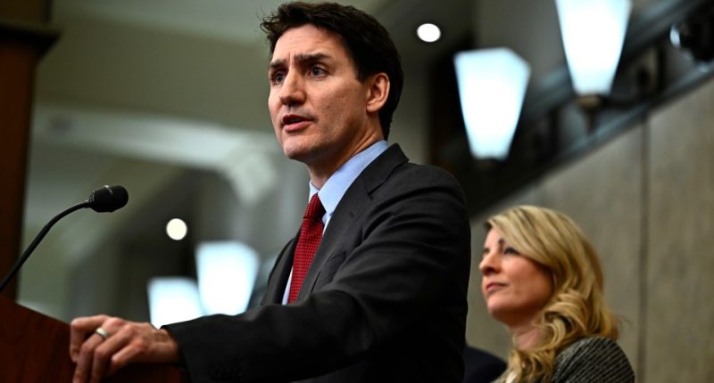 Justin Trudeau speaking at a podium.