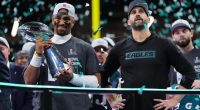 Jalen Hurts and Nick Sirianni celebrating Super Bowl victory with the Lombardi Trophy.
