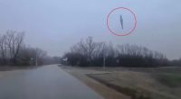 Dashcam footage of a missile falling from the sky.