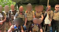Group photo of soldiers in camouflage uniforms.