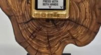 Netanyahu's gift to Trump: a gold pager on a wood plaque.