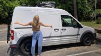 Gabby Petito standing next to a white van.