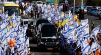 Funeral procession with Israeli flags.