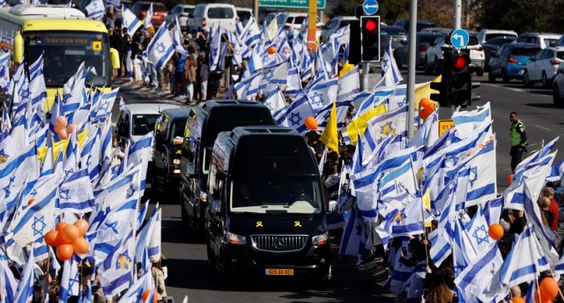 Funeral procession with Israeli flags.