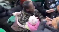 Horrifying moment Eagles fan holding a baby fights with woman