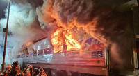 SEPTA train engulfed in flames, firefighters responding.