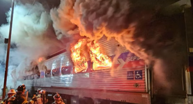 SEPTA train engulfed in flames, firefighters responding.