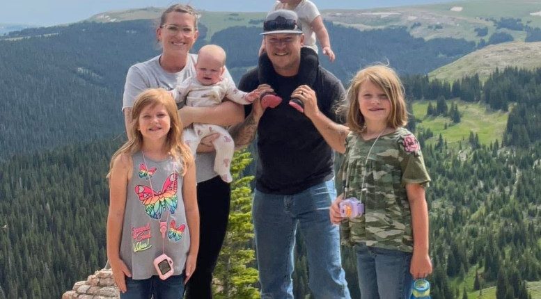 Family sledding in the snow.
