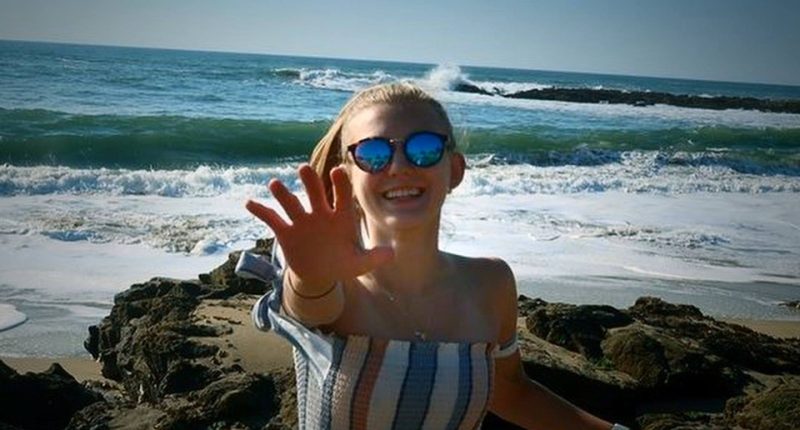 Photo of Gabby Petito at the beach.