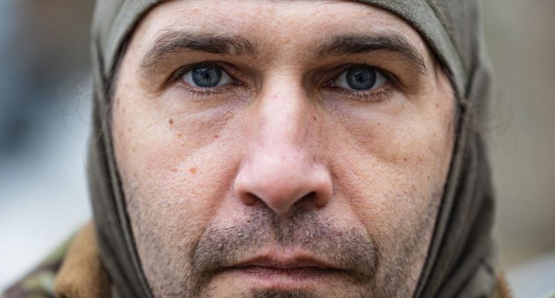 Close-up portrait of Caesar, a 50-year-old Russian fighting with the Freedom of Russia Legion in Ukraine.