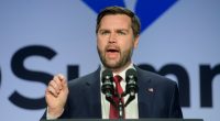 JD Vance speaking at a podium.