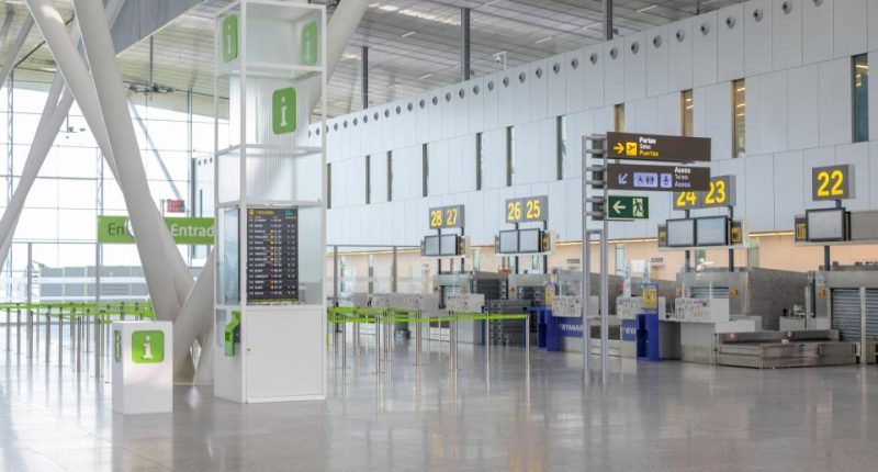 Empty airport check-in counters.