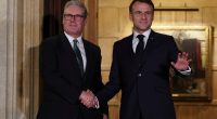 Keir Starmer and Emmanuel Macron shaking hands.