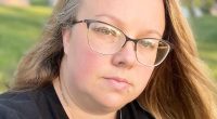 Portrait of a woman wearing glasses.
