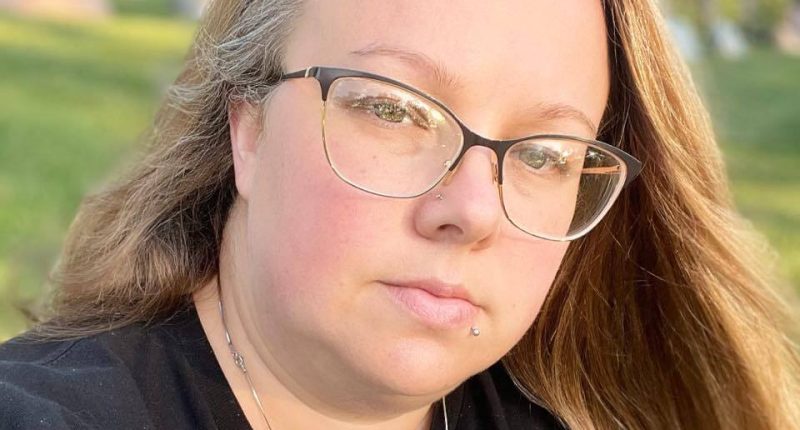 Portrait of a woman wearing glasses.