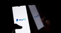 PayPal logo on a smartphone screen.