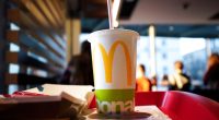 Coca-Cola in a McDonald's cup on a tray.