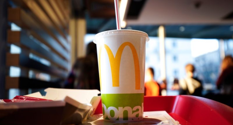 Coca-Cola in a McDonald's cup on a tray.