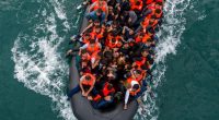 Aerial view of migrants in an inflatable dinghy.
