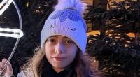 Girl wearing a unicorn beanie.