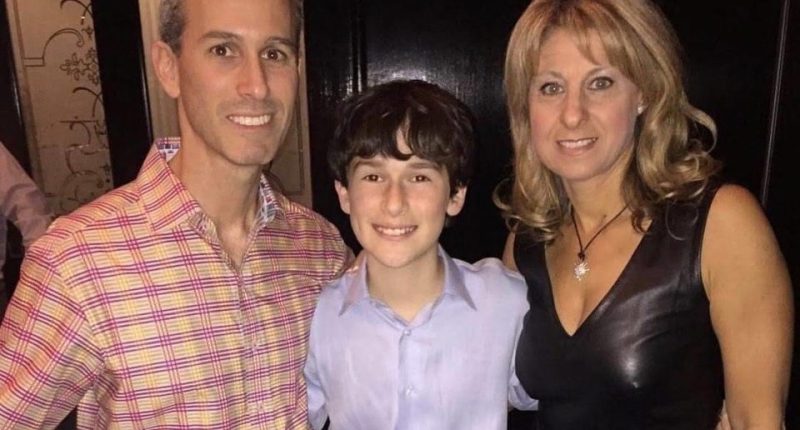 Family photo of a father, mother, and son.