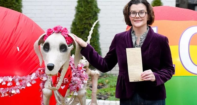 Neighborhood at war over family's distasteful front yard display