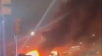 Large fire burning in the street.