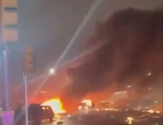 Large fire burning in the street.