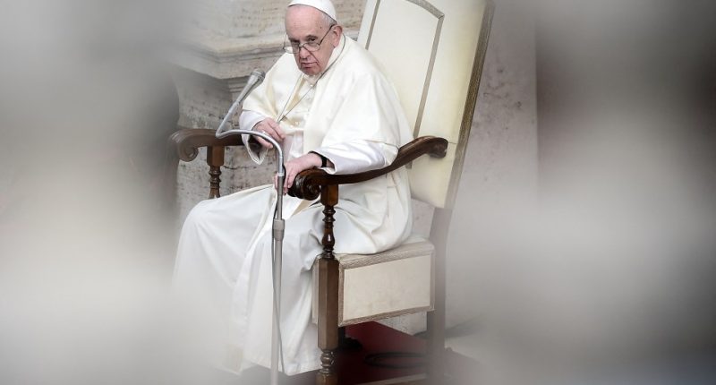 Pope Francis seated in a chair.