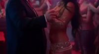 Donald Trump dancing with a woman in a nightclub.