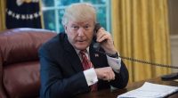 President Donald Trump on the phone in the Oval Office.