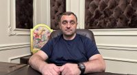 Armen Sarkisyan, founder of the Arbat stormtrooper battalion, sitting at a desk.