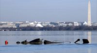 Recovery crews return to the Potomac debris after the deadly plane and helicopter crash