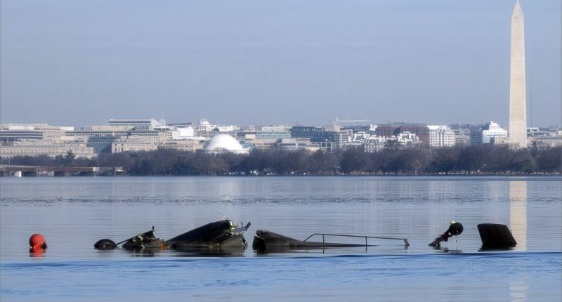 Recovery crews return to the Potomac debris after the deadly plane and helicopter crash