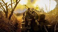 Ukrainian soldier firing a howitzer.