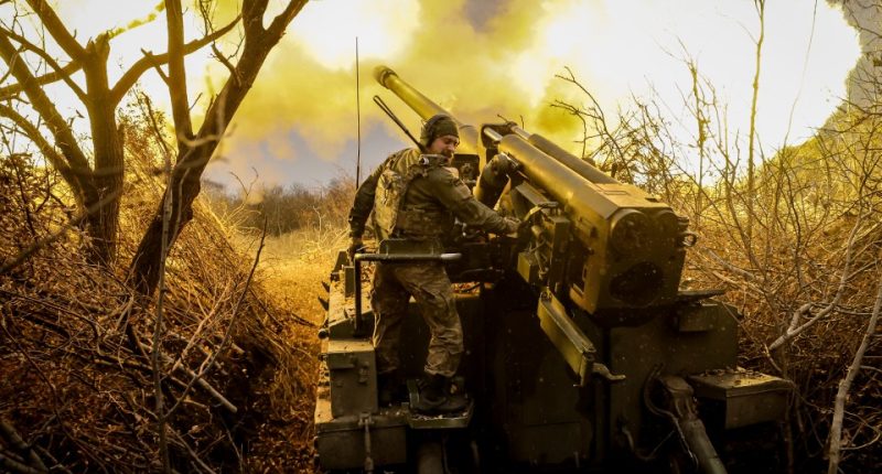 Ukrainian soldier firing a howitzer.