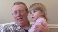 Man holding a toddler.
