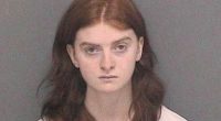 Mugshot of a young woman with long brown hair.