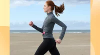 Woman power walking on the beach.